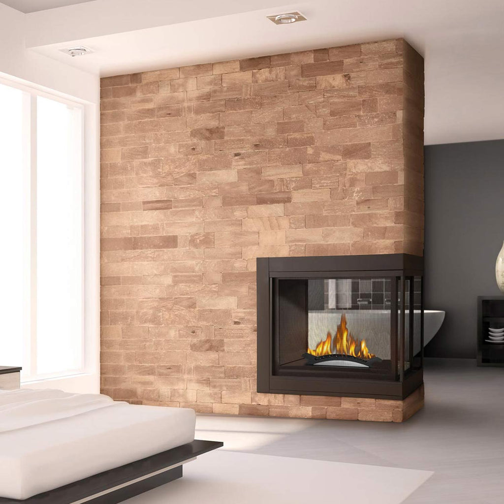 Black gas fireplace insert with orange flames set in a stone surround frame