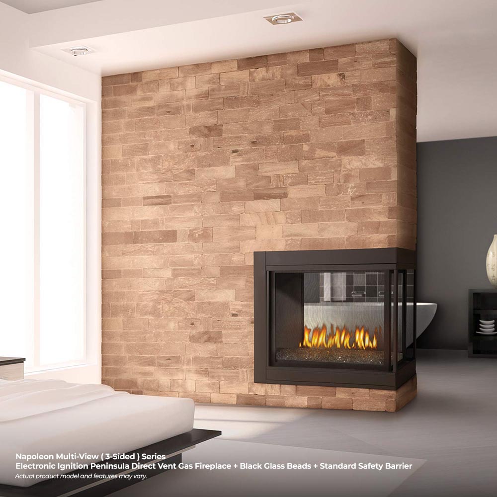 Black gas fireplace insert with glowing orange flames set in a surrounding frame