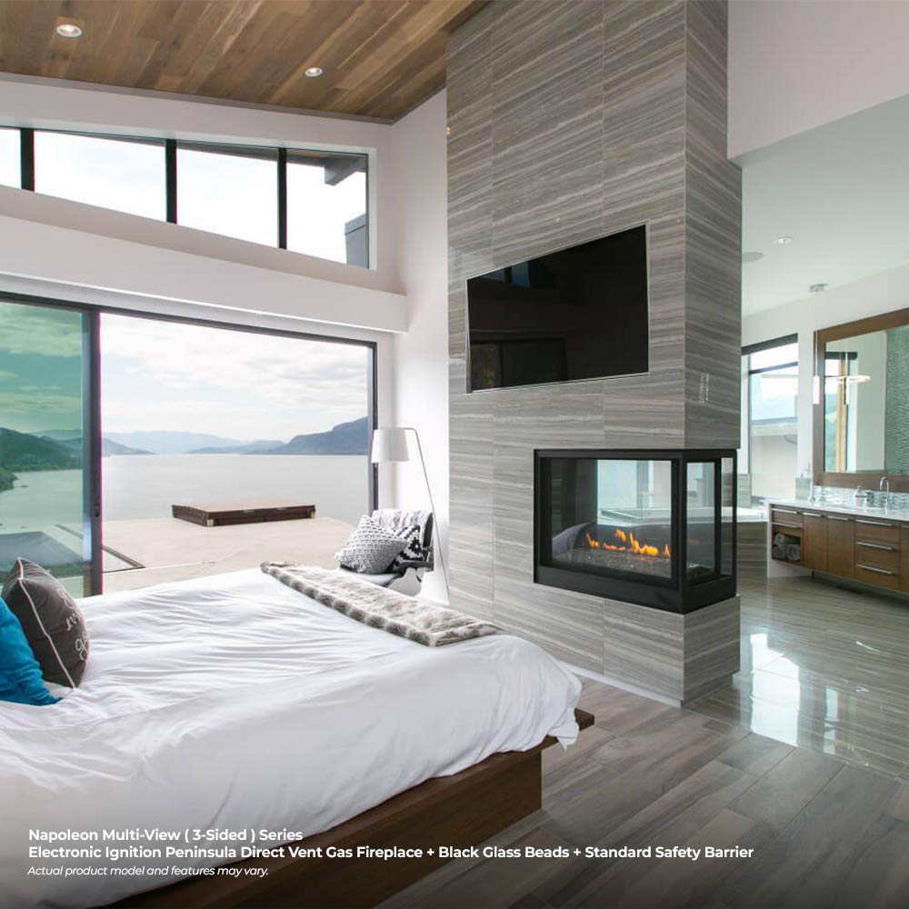 Black multi-view gas fireplace insert with orange flames in a rectangular viewing window