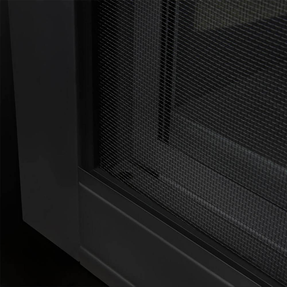 Black mesh safety barrier panel along the gas fireplace opening frame