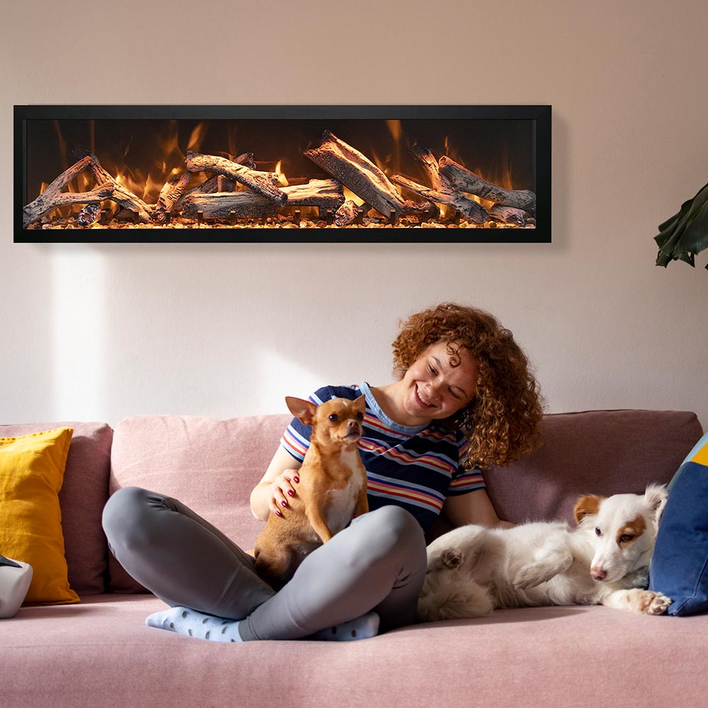 Slim wall electric fireplace with burning flame effect and visible log bed behind glass.