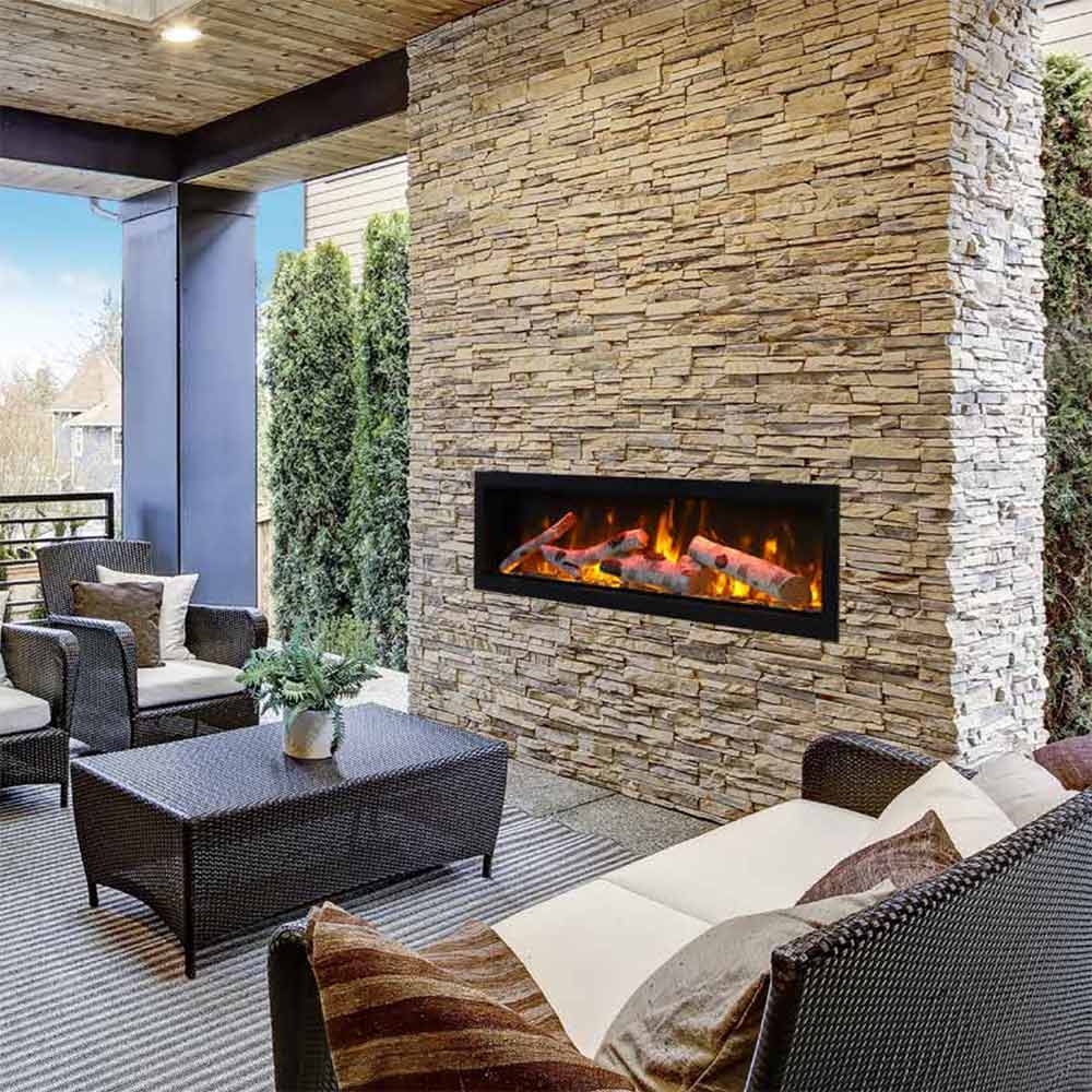 Built-in electric fireplace insert in stone wall with rectangular black frame and flames