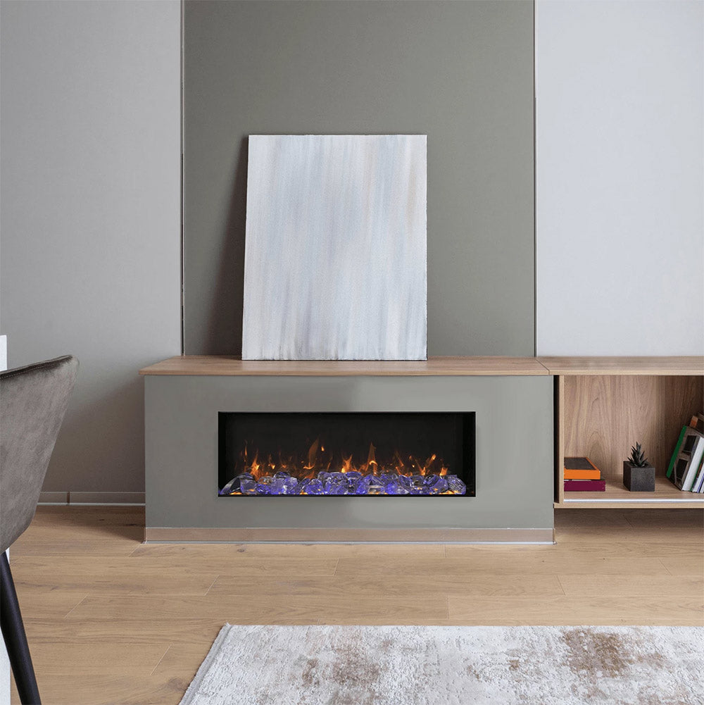 Built-in electric fireplace insert with flame effect inside a light wood surround