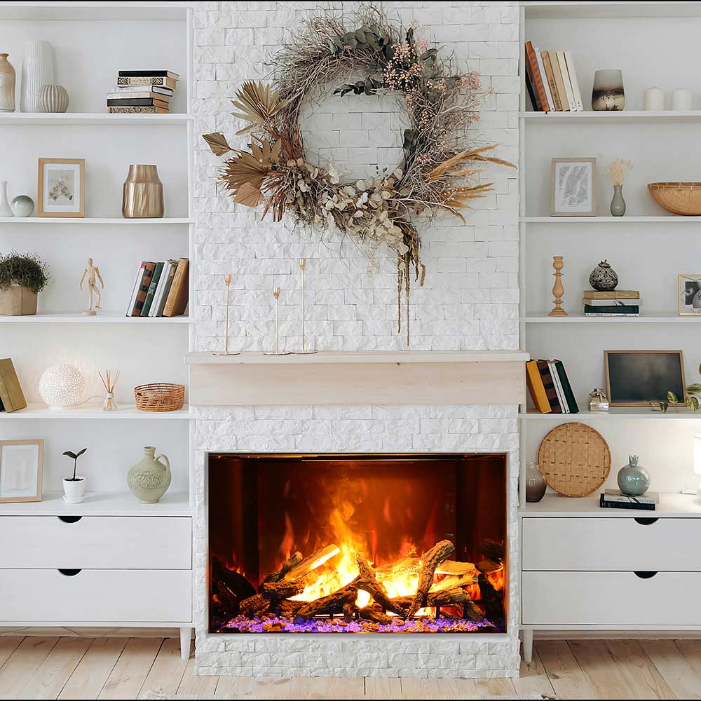 Electric vapour fireplace in white brick surround with burning logs and orange flame.
