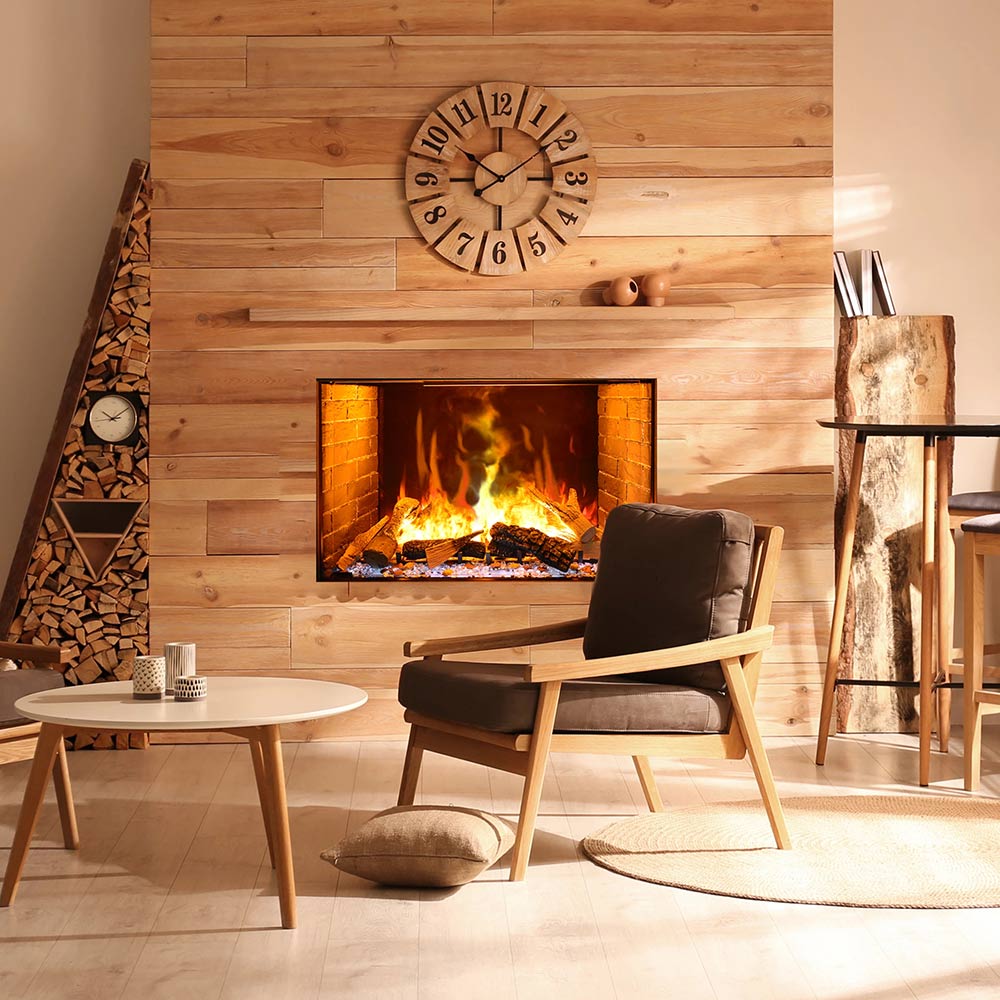 Electric vapour fireplace with orange fire in framed opening on wood-paneled wall.