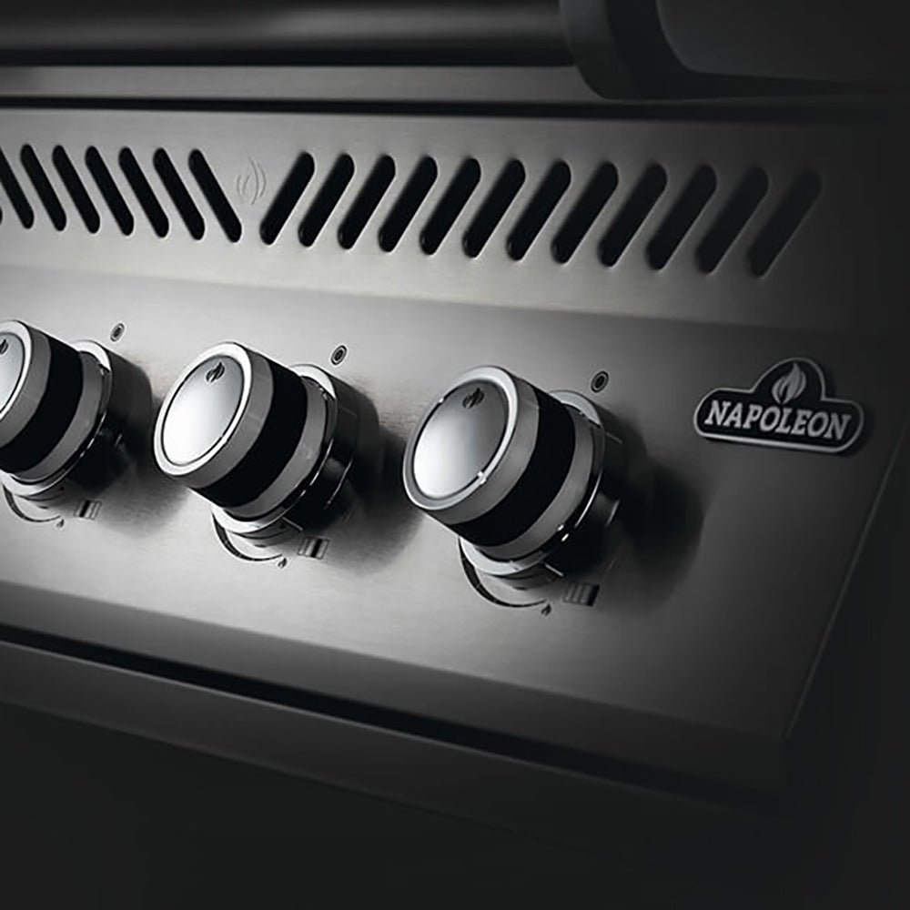 Stainless steel control panel with four burner knobs and Napoleon logo on built-in gas grill