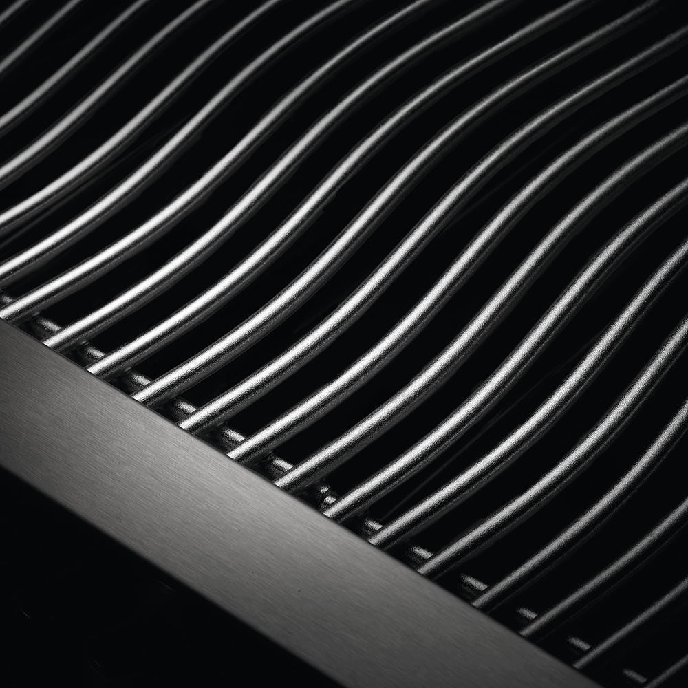 Stainless steel ribbed cooking grates inside a built-in gas grill