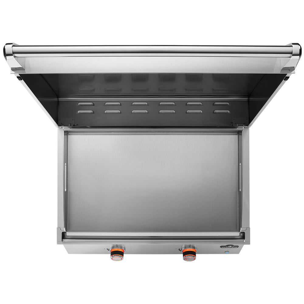Built-in flat top griddle with raised cover showing empty cooking tray area