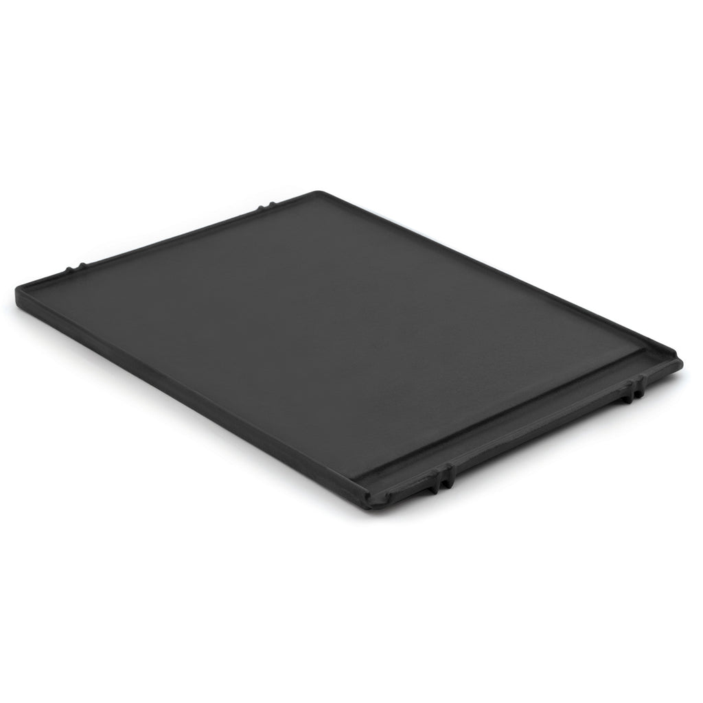Cast iron griddle plate with flat black surface and corner tabs