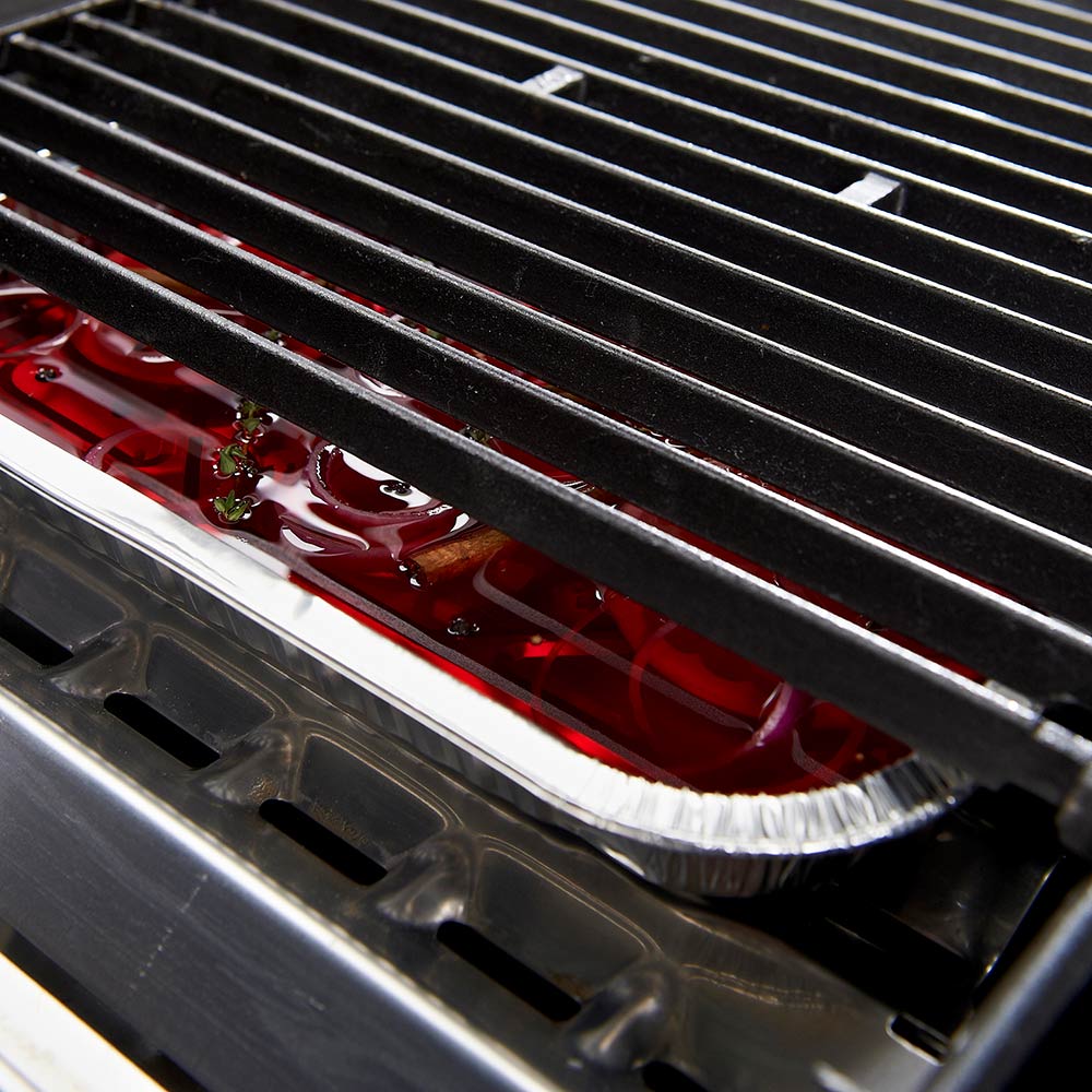 Aluminum drip pan tray beneath grill grates, catching drippings, silver