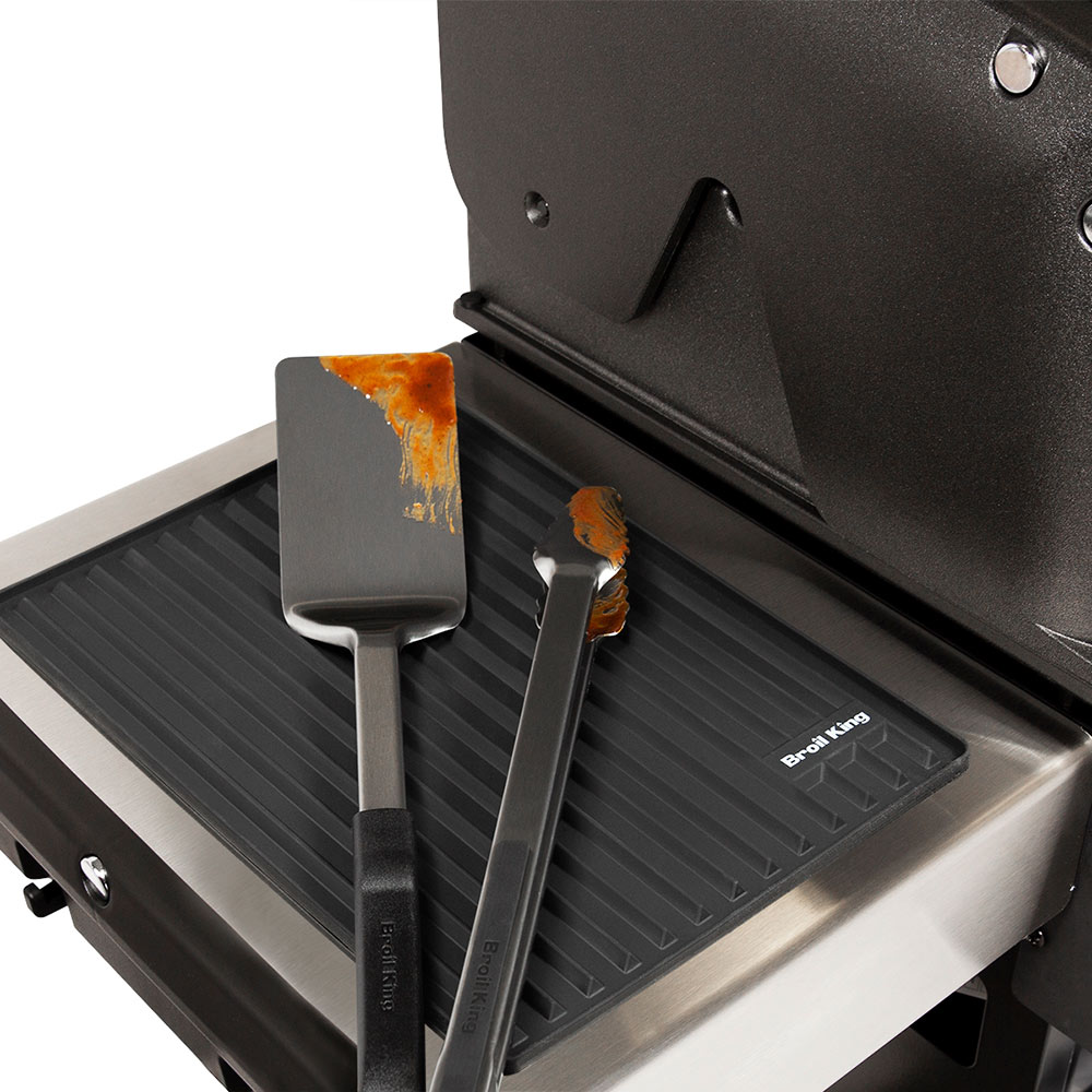 Black silicone side shelf mat on grill side shelf with ridged surface