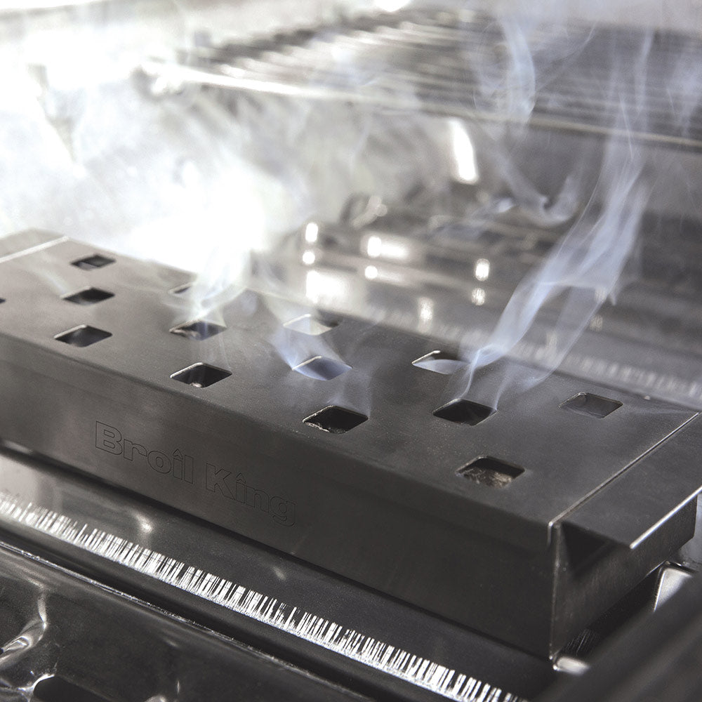 Metal smoker box lid close-up with vent holes and embossed logo