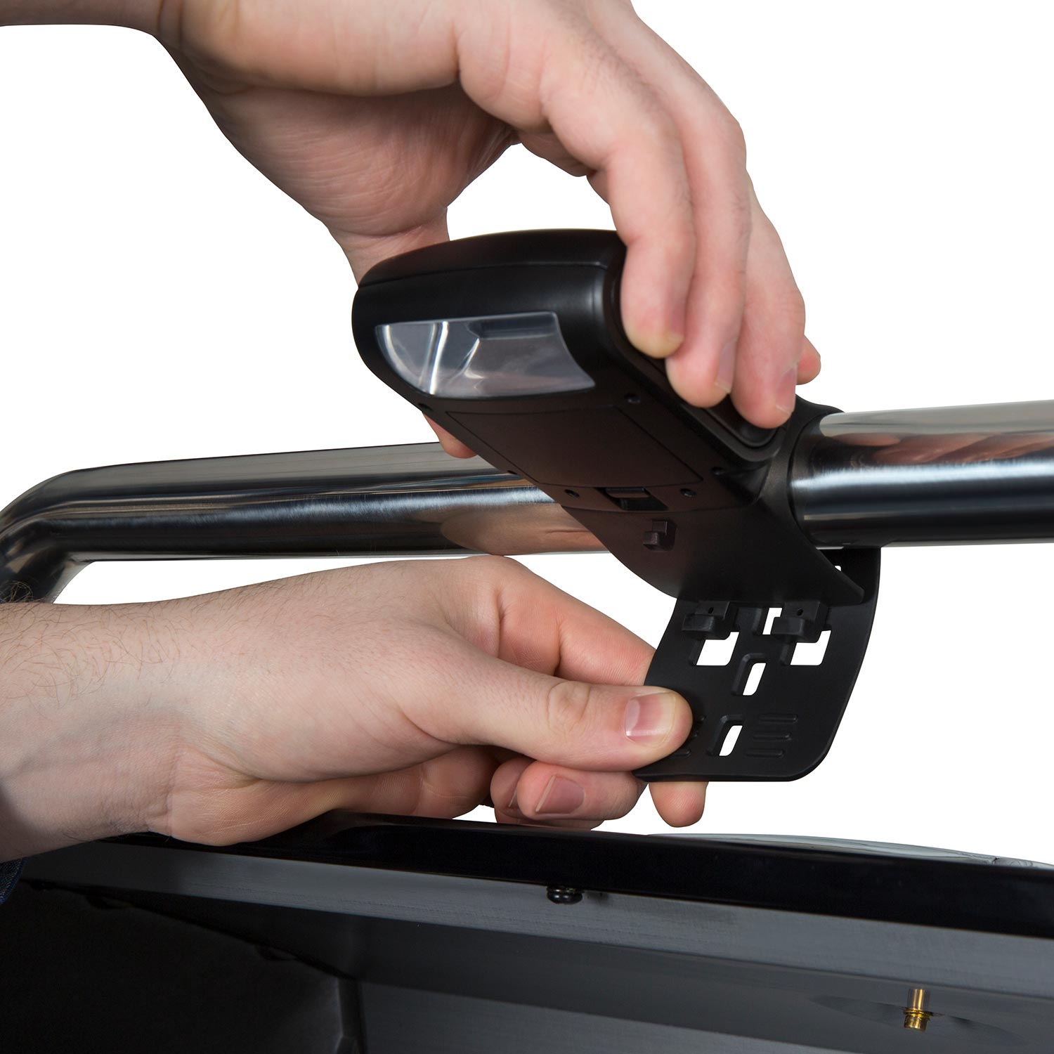 Broil King grill light installation on grill lid with hands holding the unit
