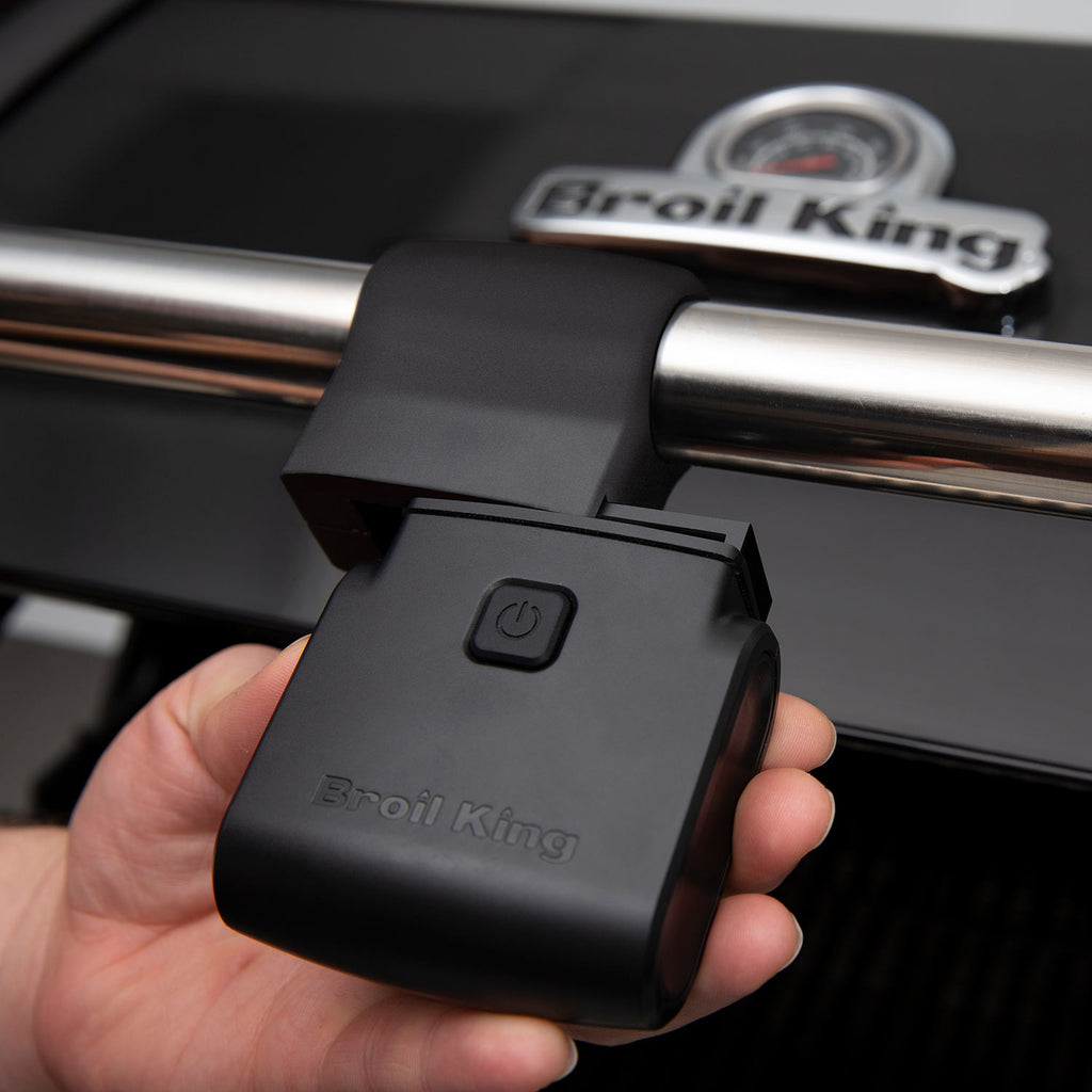 Black grill handle light with power button and Broil King logo on housing