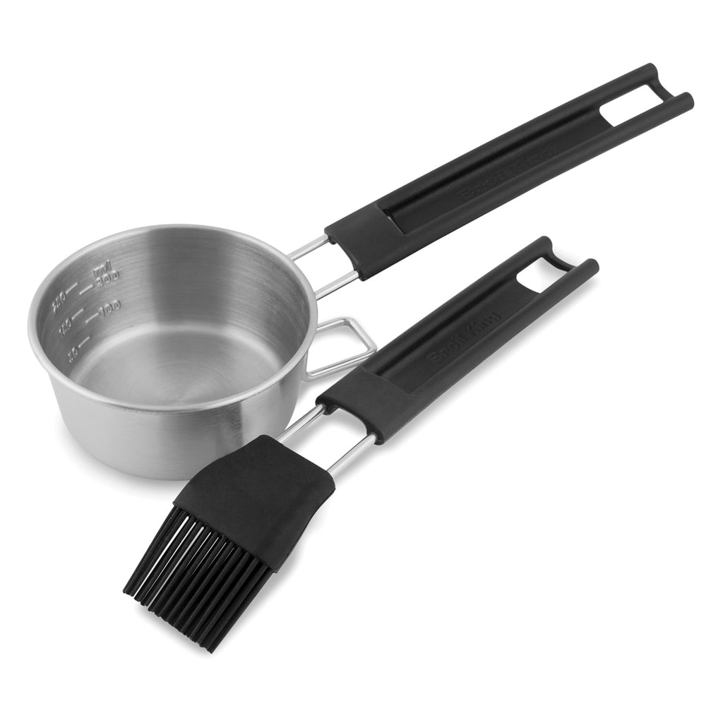 Basting set with stainless pot and two black basting brushes with silicone grips