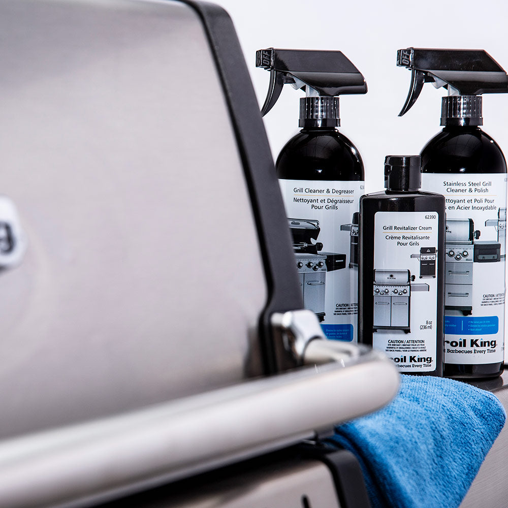 Broil King Grill Revitalizer Cream sprayer bottles set beside grill surfaces