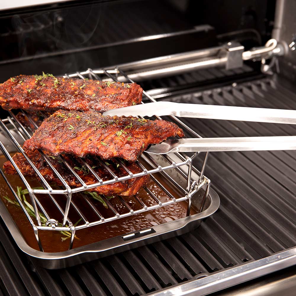 Stainless steel rack holding two seasoned meat slabs on grill grates