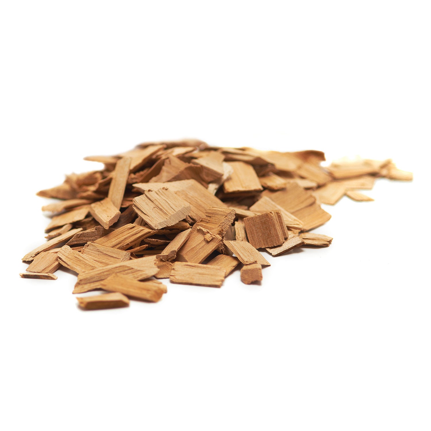 Pile of mesquite wood chips, tan wood flakes and small chunks for grilling