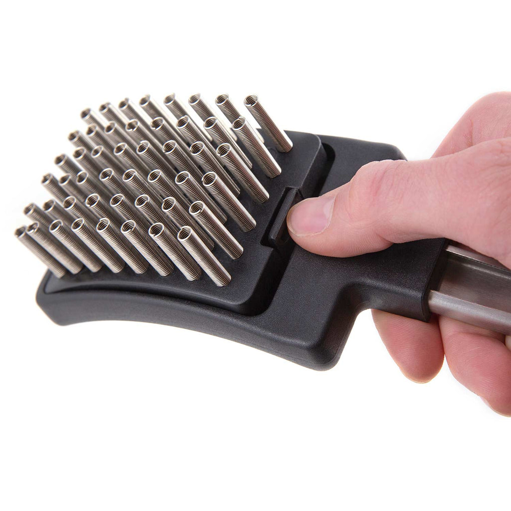 Grill brush head with silver coil spring bristles and black base, handheld close-up