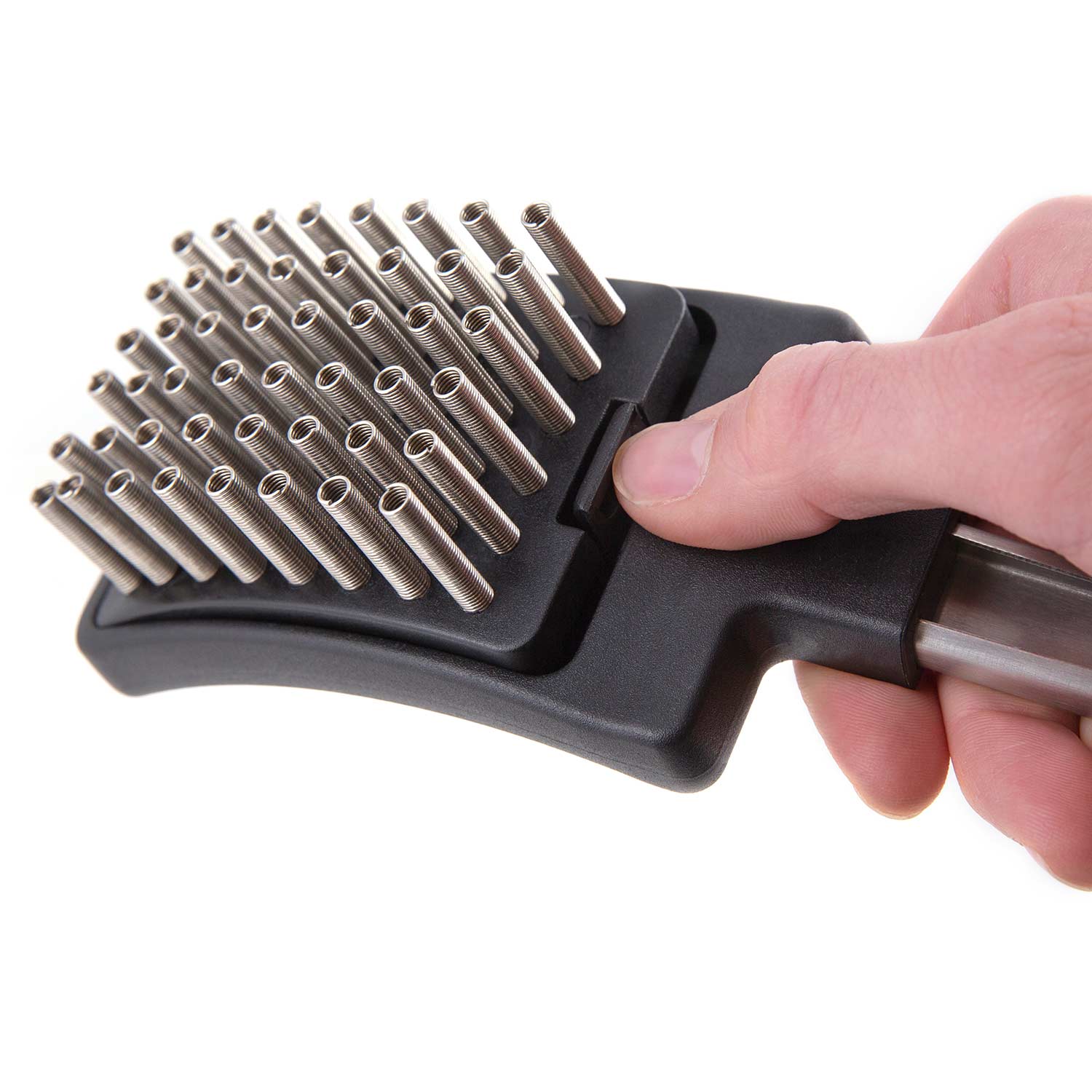 Grill brush head with silver coil spring bristles and black base, handheld close-up
