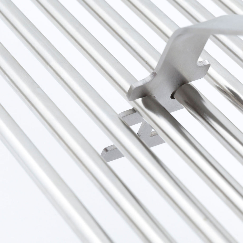 Broil King grid lifter metal prongs holding on silver grill grates