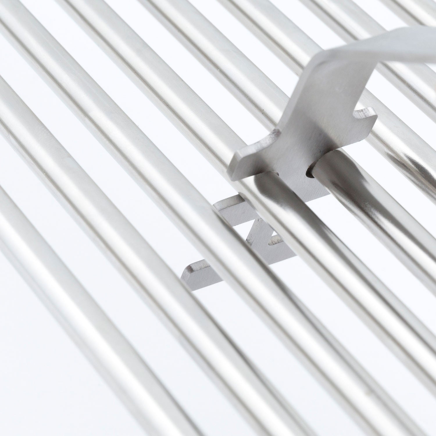 Broil King grid lifter metal prongs holding on silver grill grates