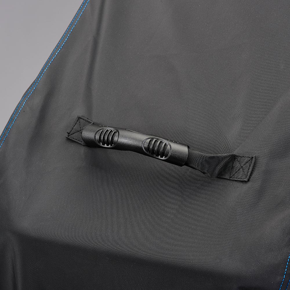 Grill cover fabric close-up with elastic strap and black grommets, blue stitching