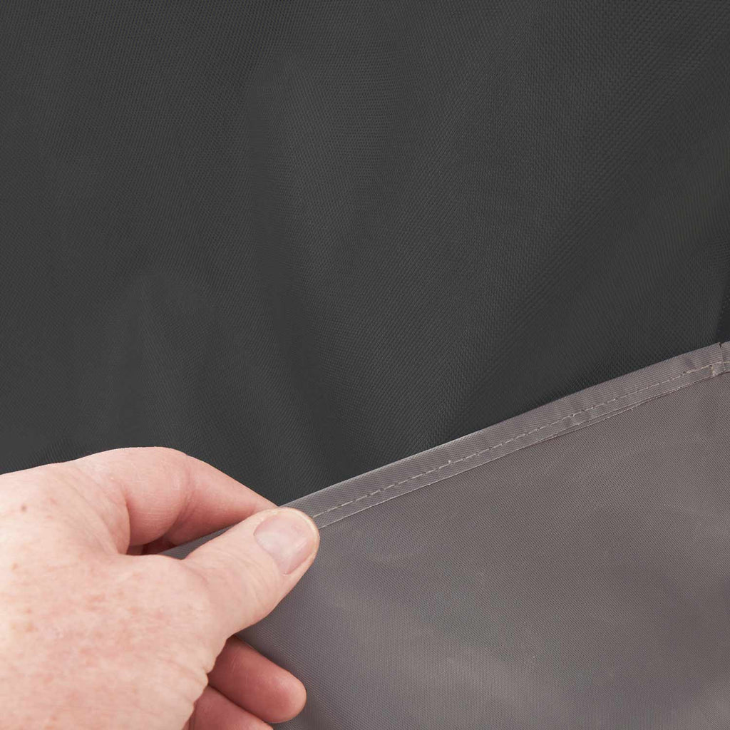 Dark grill cover with stitched edge and seam detail