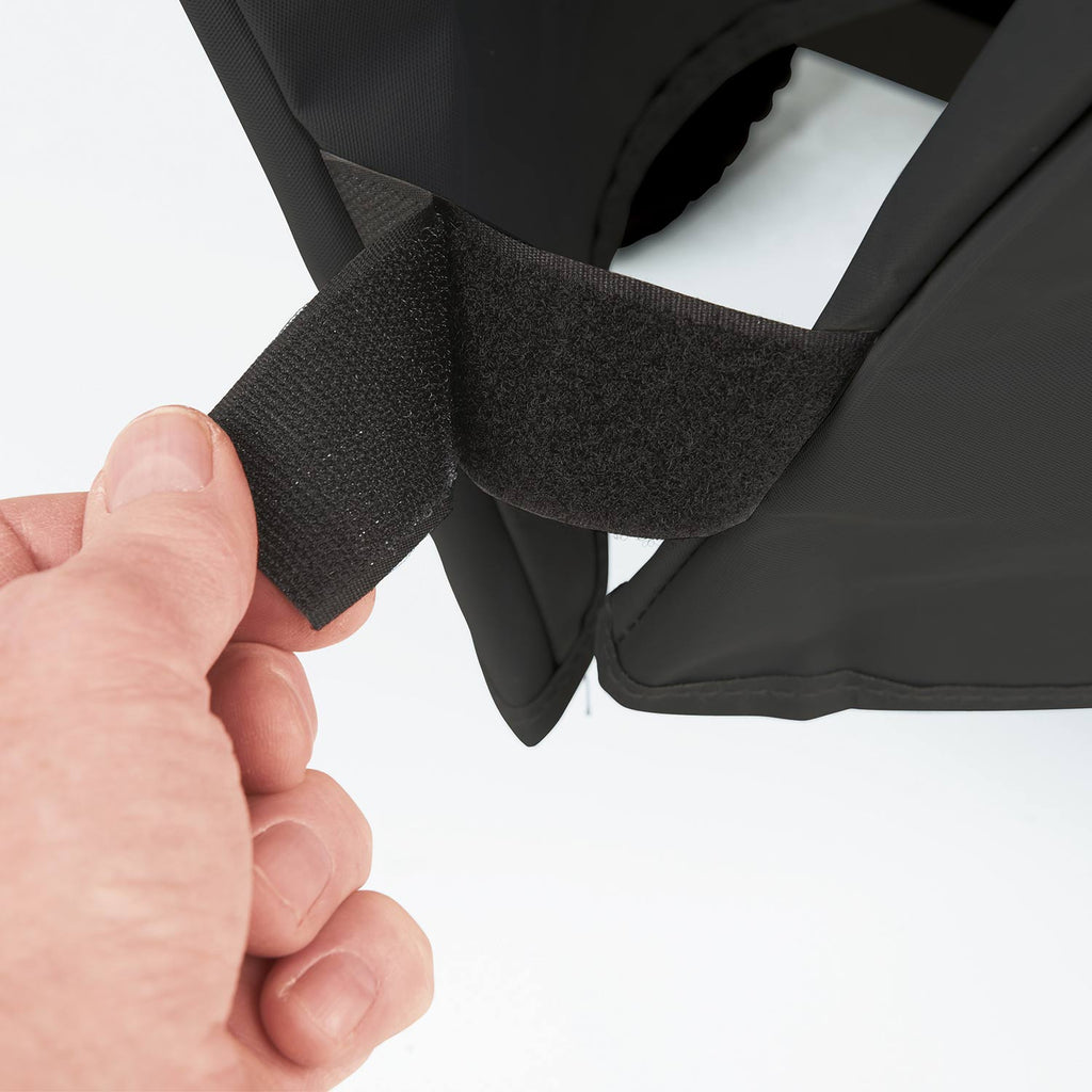 Dark grill cover side strap attachment point with holder