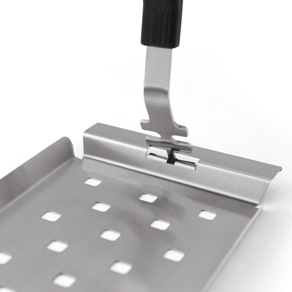 Stainless steel grill topper tray detail with perforations and front support clip