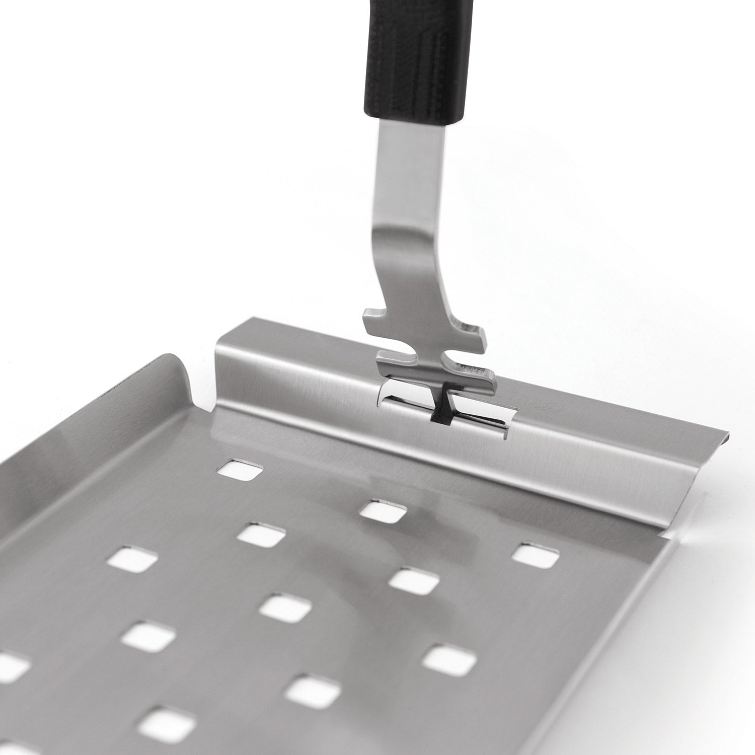 Stainless steel grill topper tray detail with perforations and front support clip