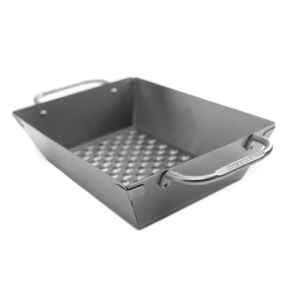 Stainless steel grill wok topper with perforated bottom and side handles.