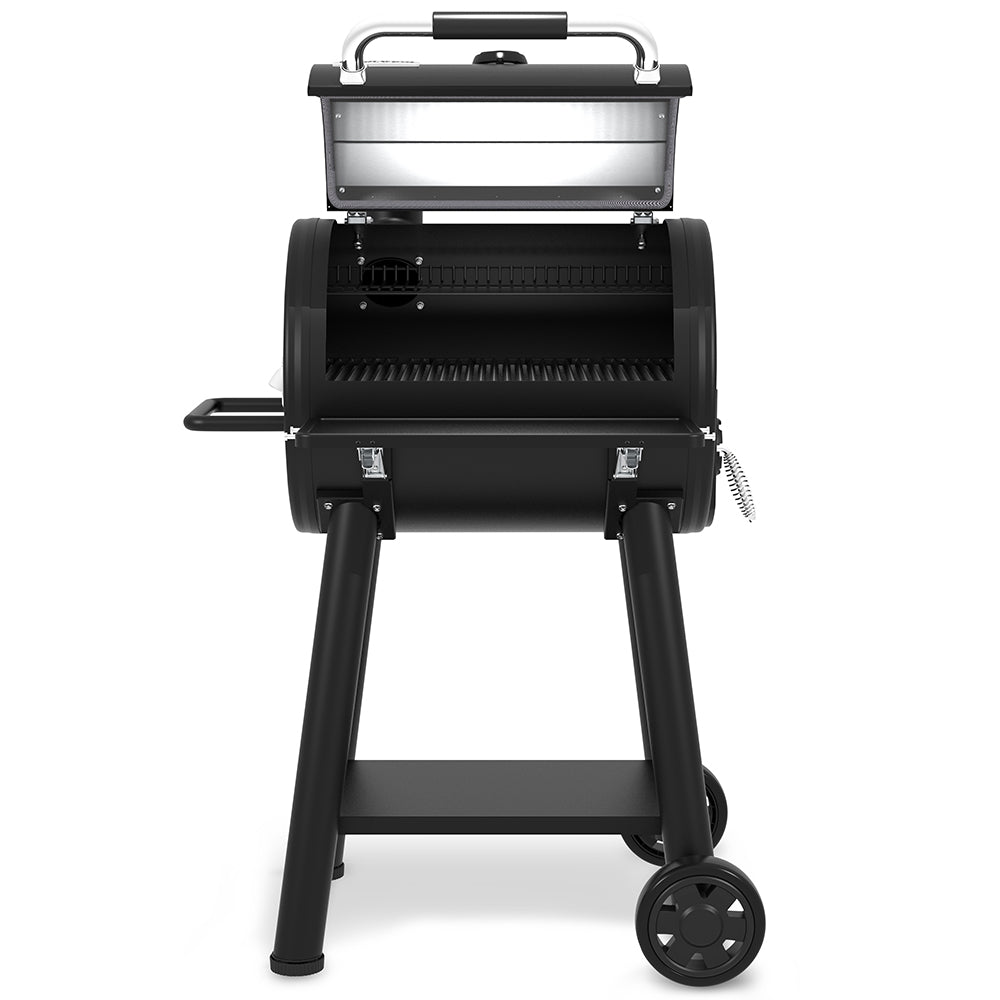 Broil King charcoal smoker grill with open lid and interior cooking grates