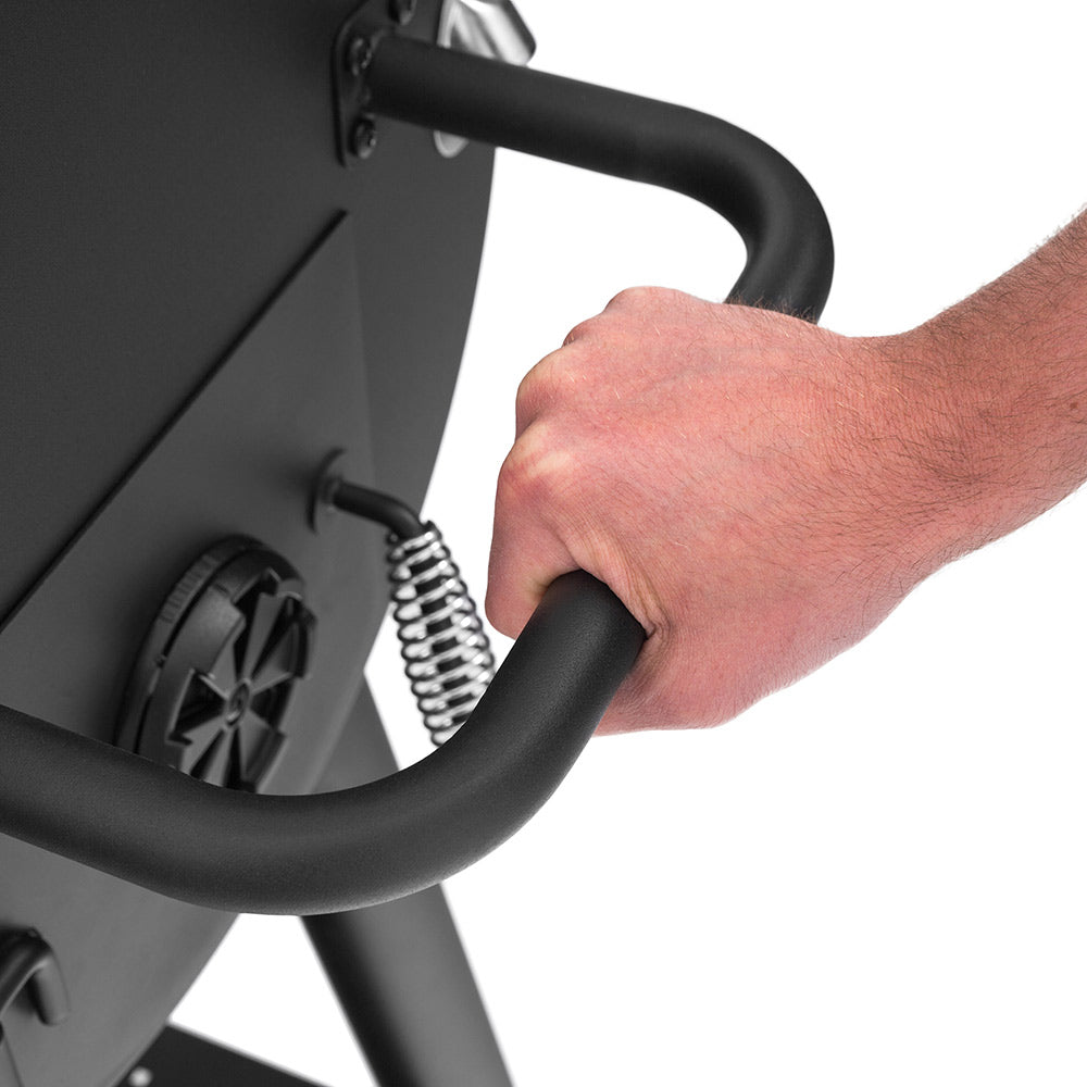 Smoker handle and spring assembly on the side of the charcoal grill