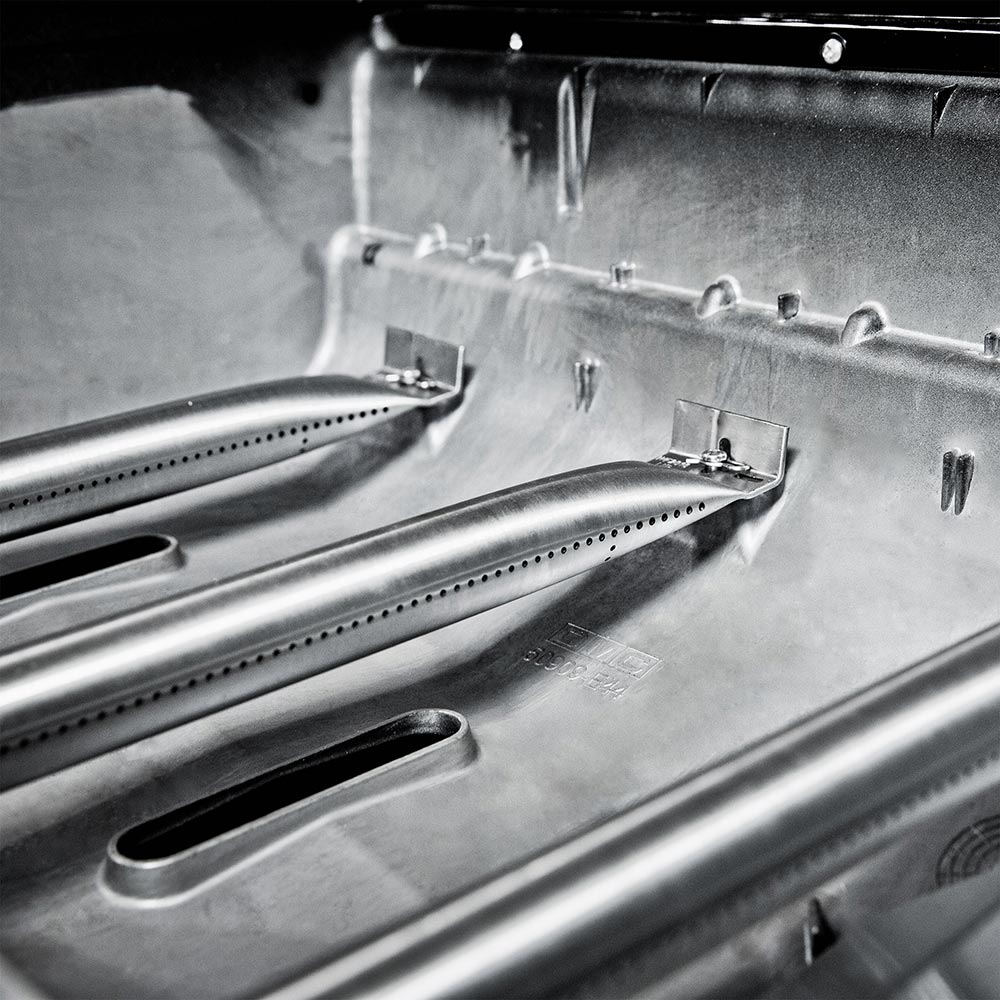 Stainless grill interior with burner bars and small ignition hardware