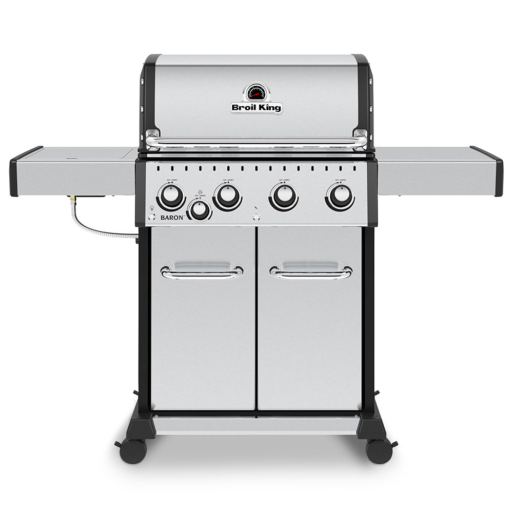 Stainless steel 4-burner gas grill with side shelves and front control knobs, lid closed