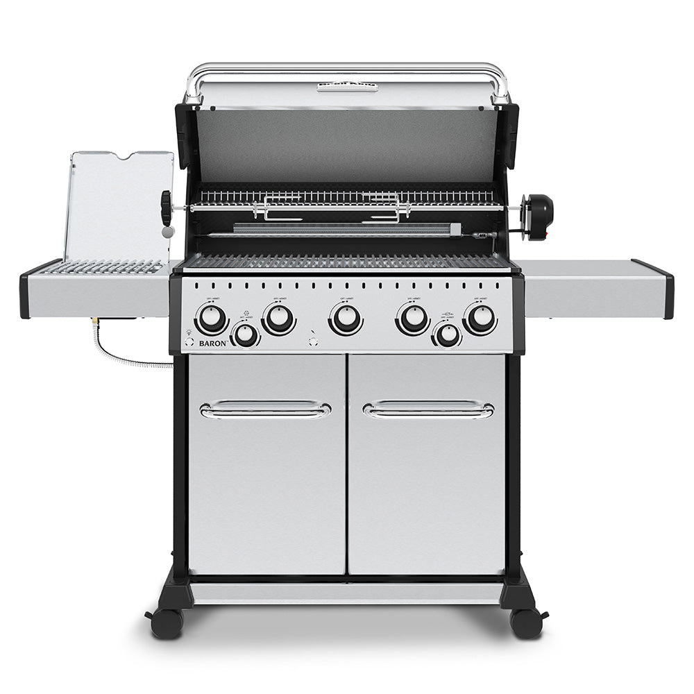 Stainless steel gas grill with open lid, burners visible, and side shelf