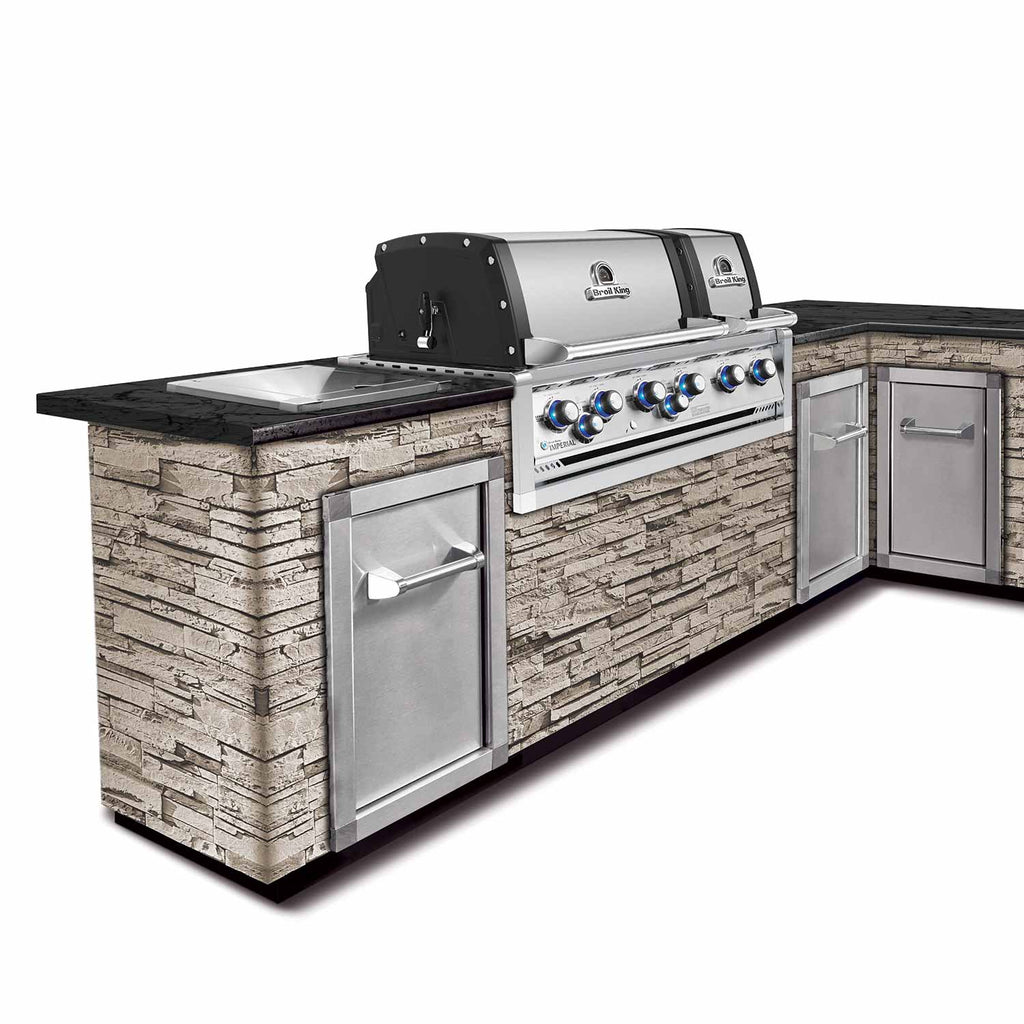 Stainless gas grill with stone side panel cabinets and open hood
