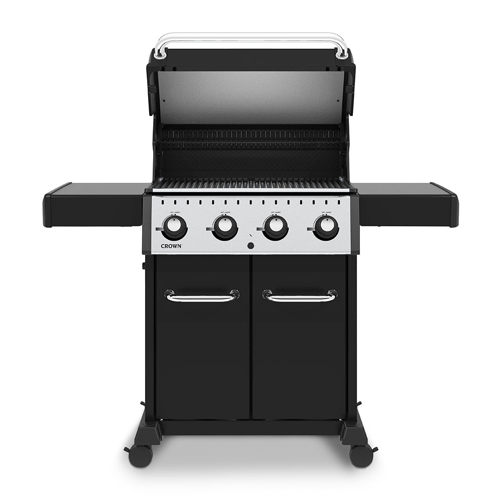 Black gas grill with lid open, warming area, and four front burner control knobs