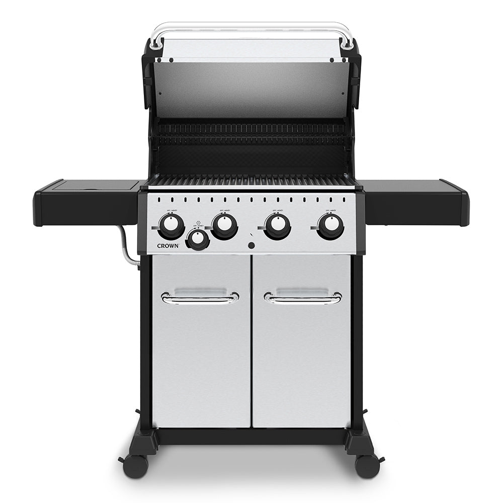 Stainless steel gas grill with open lid and four burner control knobs, front view