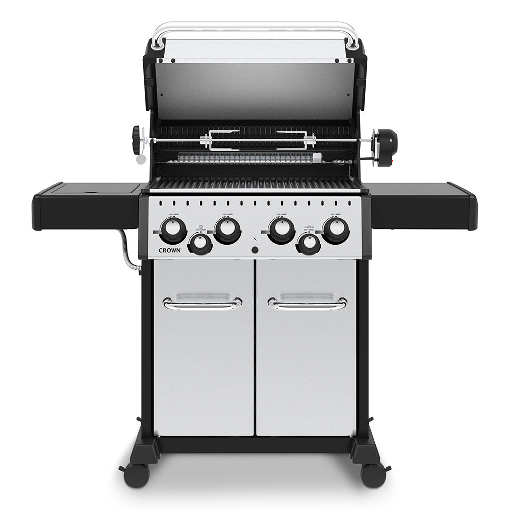 Open stainless steel 4-burner gas grill with cooking grates and control panel, front view