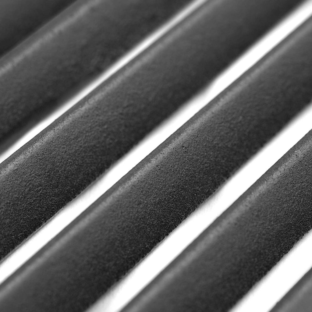 Textured black grill liner surface with a metallic edge