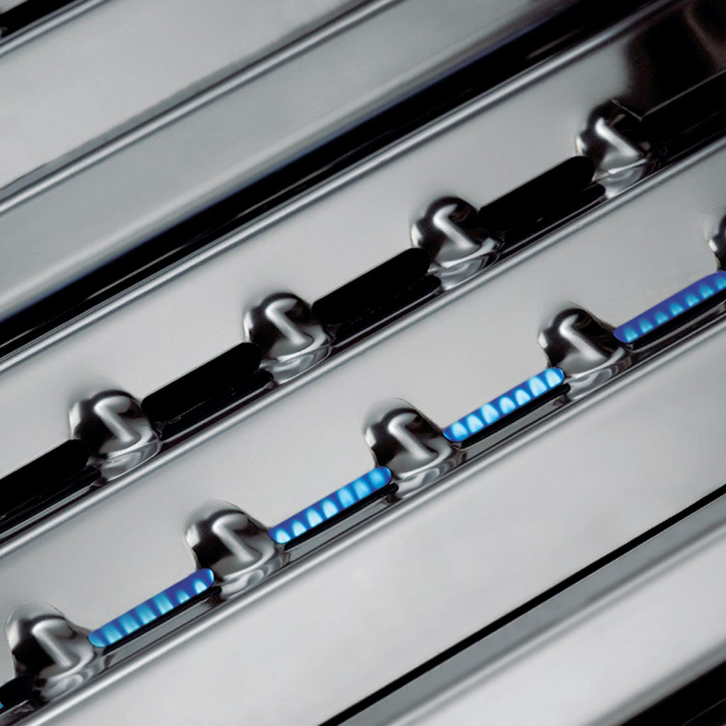 Broil King grill control strip with burner knobs above the cooking surface