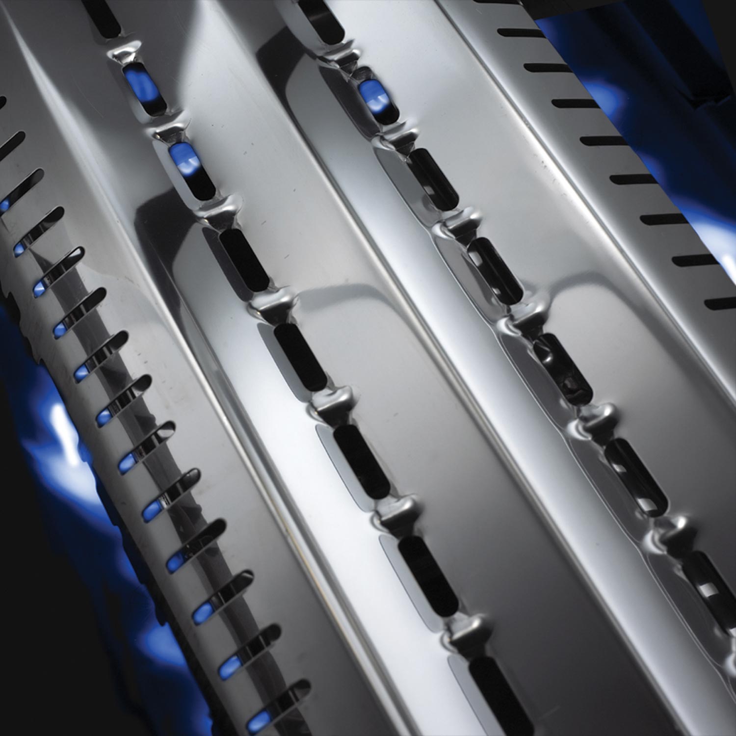 Blue-lit radiant burner tubes with stainless heat bars on Broil King grill