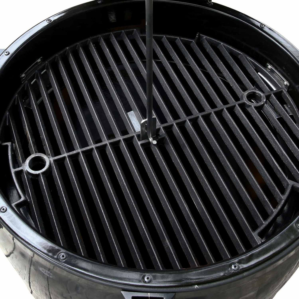 Charcoal smoker grill grate with slotted bars inside domed cook chamber, black