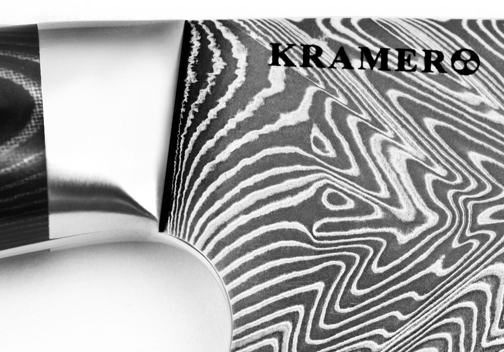 Damascus-pattern stainless carving knife blade with Kramer8 logo on steel