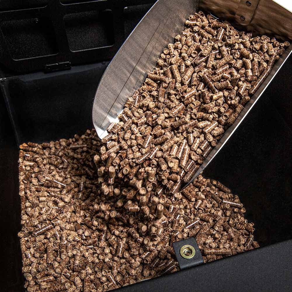 Wood pellet fuel pile in a pellet smoker hopper