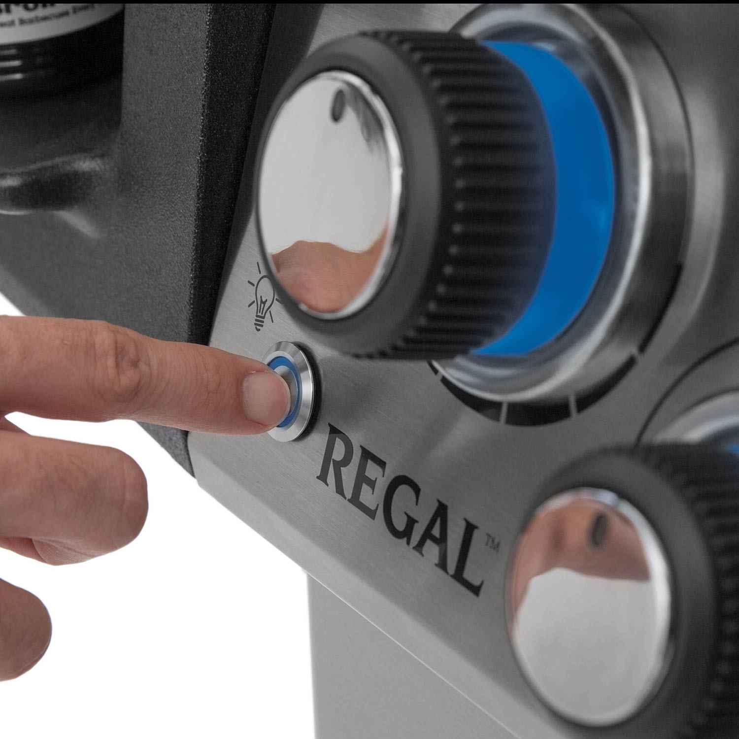 Broil King Regal control knobs on a stainless steel grill front panel
