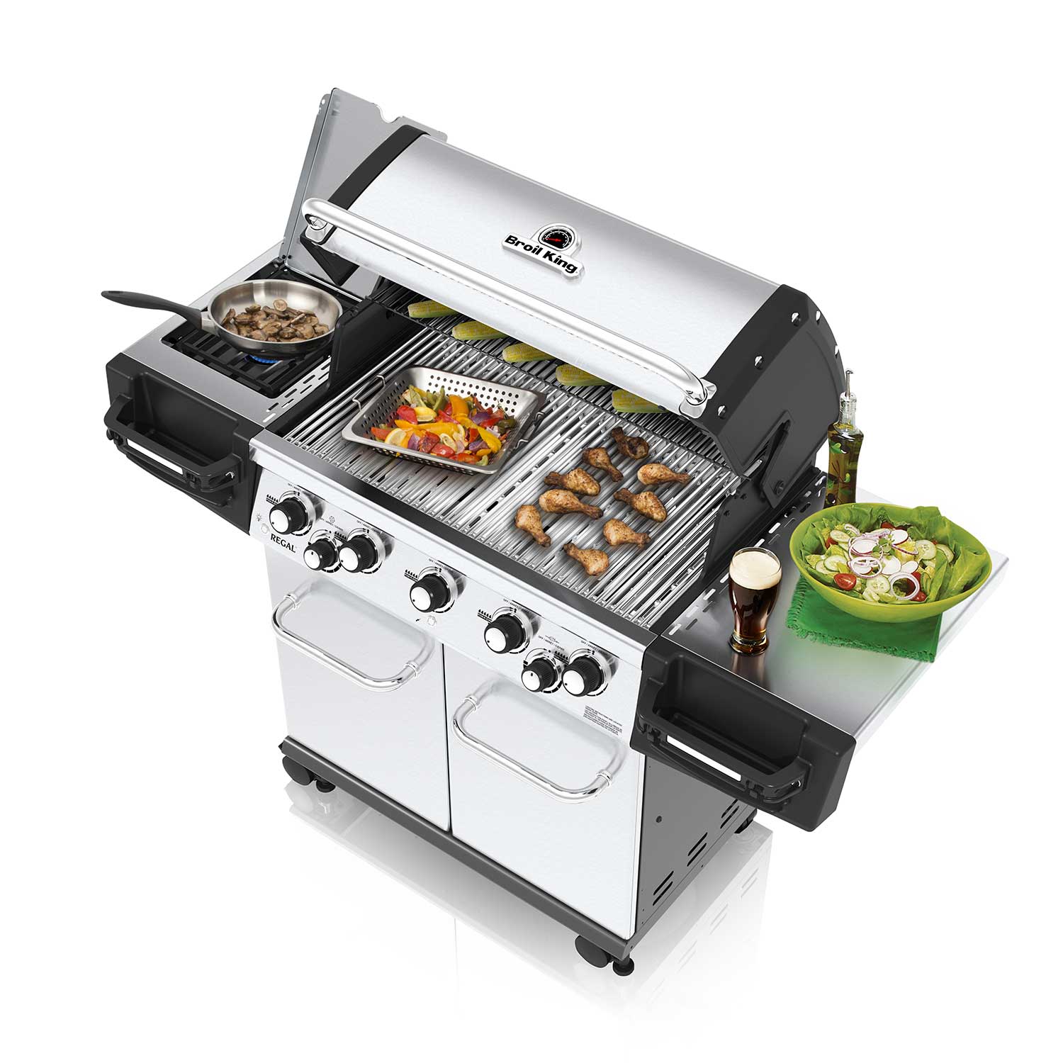 Open gas grill with food on grates and covered warming area