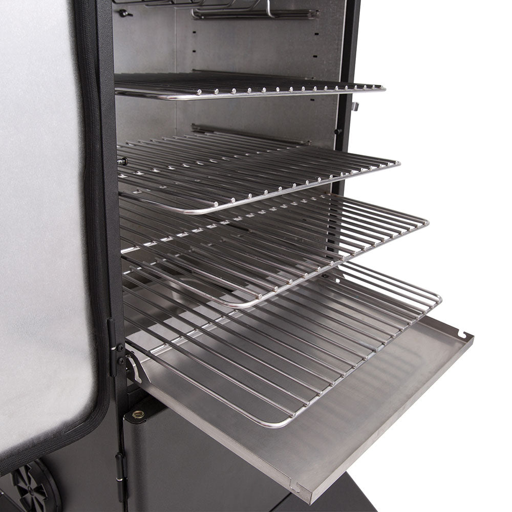 Gas smoker interior featuring three metal cooking grates